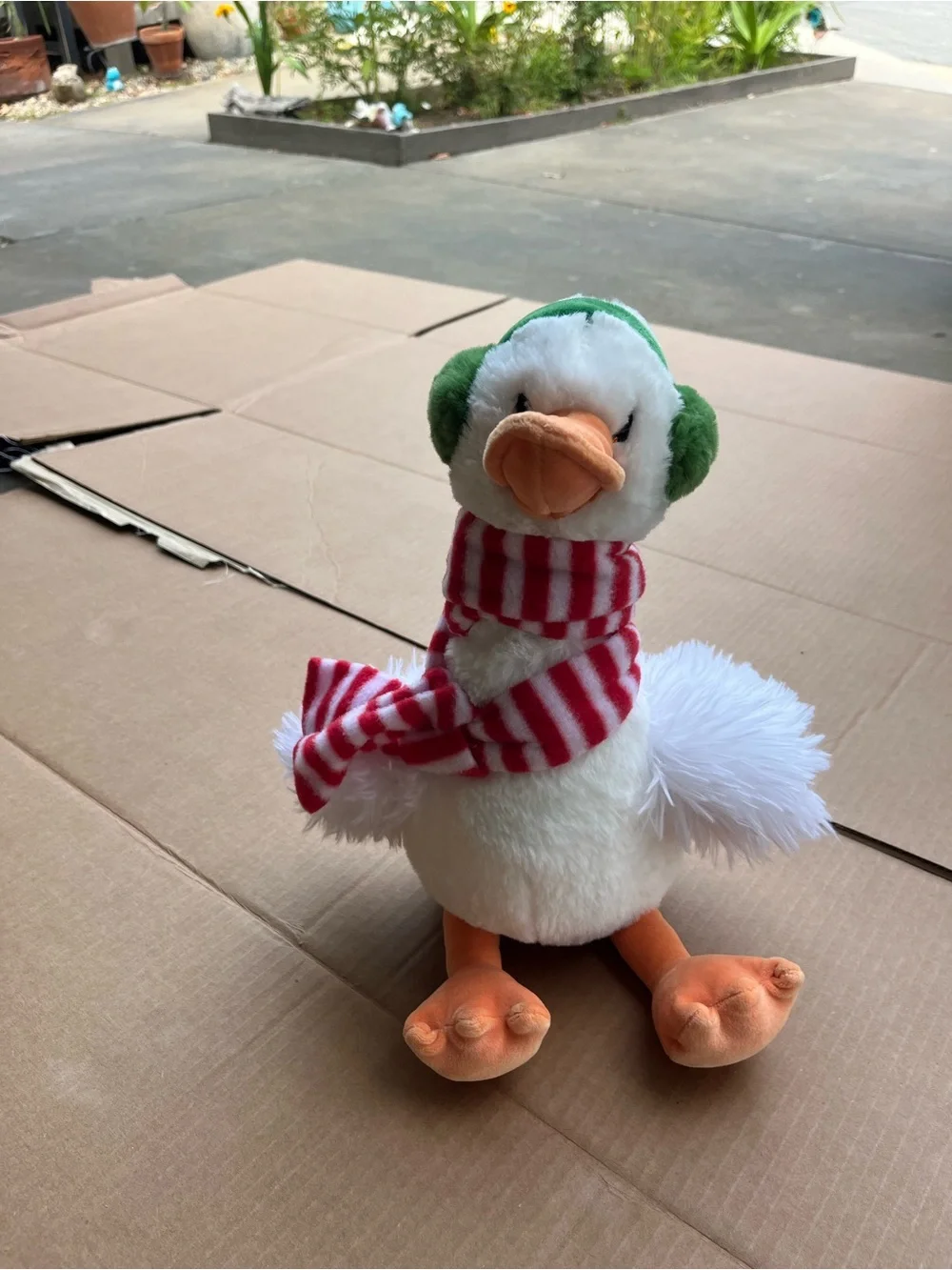 Plush Holiday Duck with Green Ear Muffs and Red Stripe Scarf